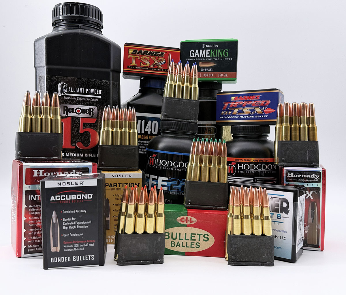 Components used to work up the traditional loads listed in the handloading table. Reloaded ammunition sits in clips ready to go to the range.